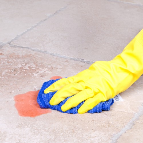 Cleaning spill on tile in Tallahassee, FL | Floorida Floors